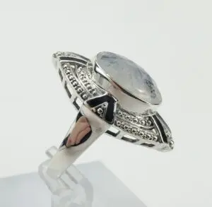 Silver ring with large oval gemstone.