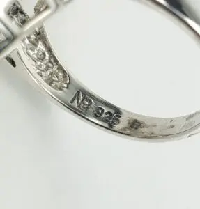 Silver ring with "925" hallmark engraving.