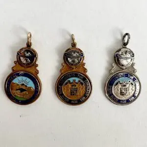 Three decorative medallions with intricate designs.
