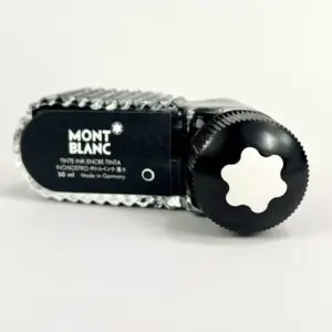 Montblanc ink bottle with black cap.
