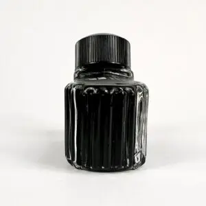 Black ink bottle with ridged design.