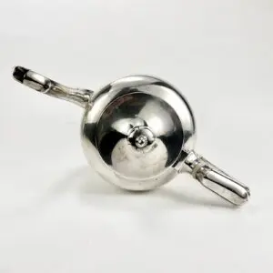 Silver teapot viewed from above.