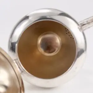 Silver teapot viewed from above.