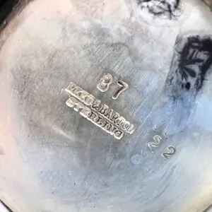 Silver object with Reed & Barton engraving.