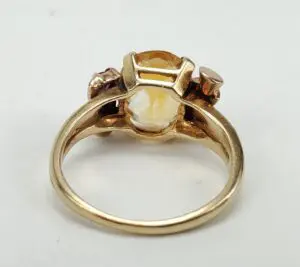 Gold ring with gemstone setting, rear view.