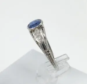 Vintage ring with blue gemstone and diamonds.