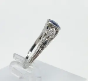 Silver ring with blue and clear gemstones.