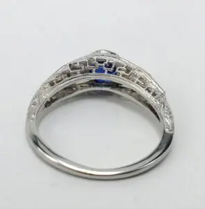 Ornate silver ring with intricate detailing.