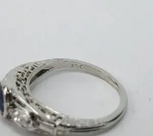 Silver ring with intricate design details.