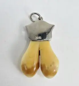 Deer hoof pendant with silver top.