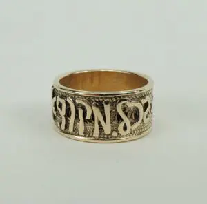 Gold ring with engraved Hebrew letters.