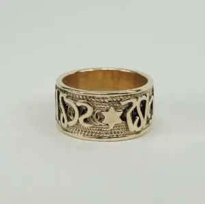 Ornate gold ring with intricate design.