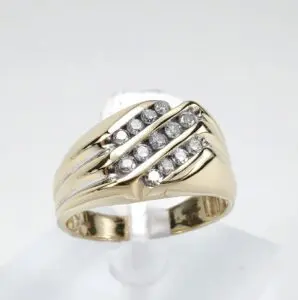 Gold ring with diagonal diamond accents.