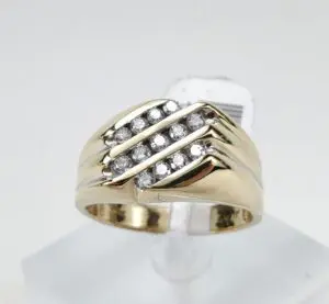 Gold ring with diagonal diamond accents.