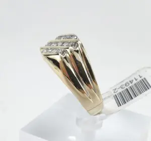 Gold ring with diamond accents on display.