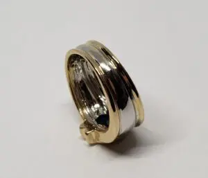 Gold and silver two-tone ring on display.