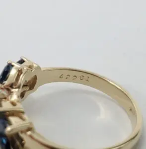 Gold ring with engraved number 42261.