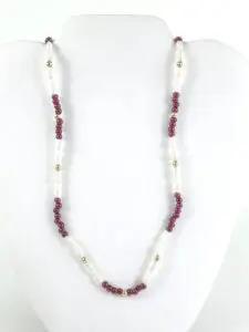 Red and white beaded necklace on display.