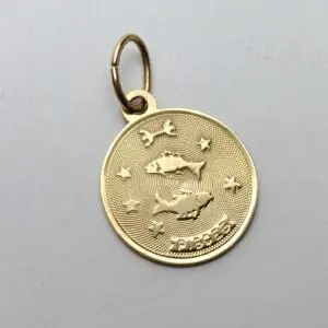 Gold Pisces pendant with fish design.