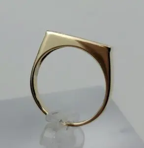 Gold ring with unique geometric design.