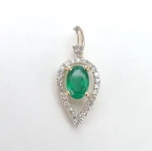 Teardrop emerald pendant with diamond accents.