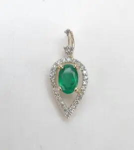 Emerald and diamond teardrop pendant jewelry.