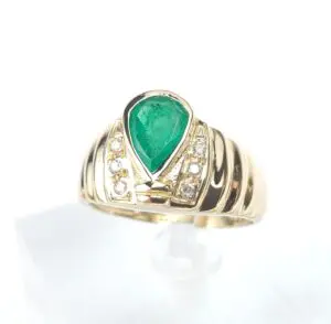 Gold ring with emerald and diamonds.
