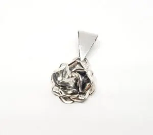 Silver rose-shaped pendant with triangular bail.