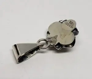 Silver clover pendant with Mexico engraving.