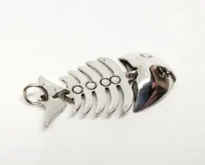 Fishbone-shaped silver keychain on white background.