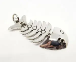 Fishbone-shaped silver metal keychain pendant.