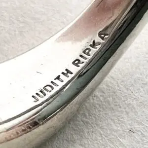 Silver bracelet with "Judith Ripka" engraving.
