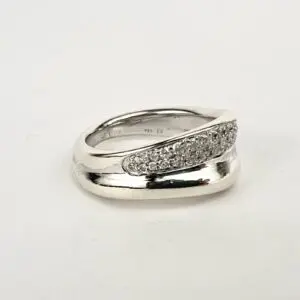 Silver ring with embedded diamonds on band.