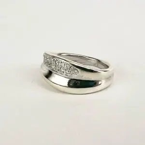 Silver ring with embedded small diamonds.