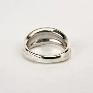 Silver twisted band ring on display.