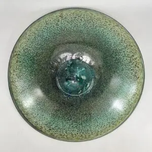 Green textured ceramic bowl, top view.