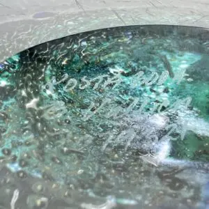 Abstract turquoise and white textured surface.