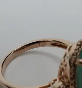 Gold ring with engraved inscription inside.