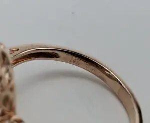 Gold ring with "14K" engraving.