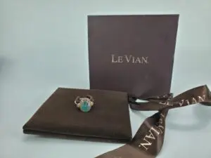 Ring with green gemstone and Le Vian box.