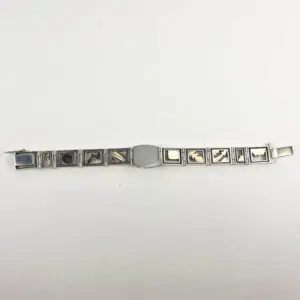 Silver bracelet with engraved square links.