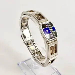 Silver bracelet with geometric enamel designs.