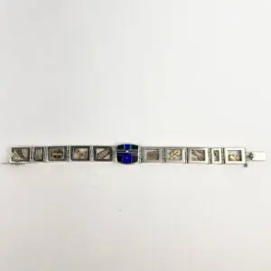 Silver bracelet with engraved rectangular links.