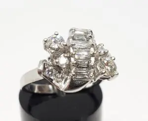 Silver ring with multiple sparkling gemstones.