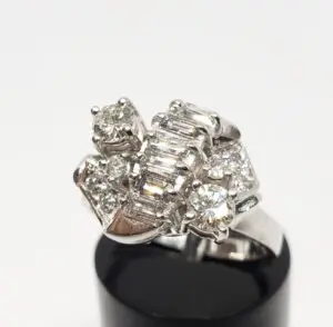 Silver ring with multiple sparkling diamonds.