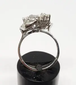 Silver ring with intricate gemstone setting.