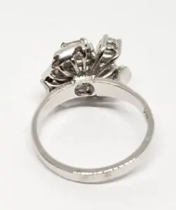 Silver ring with intricate floral design.