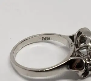 Silver ring with "18k" engraving.