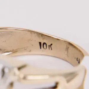 Gold ring with "10K" engraving inside band.