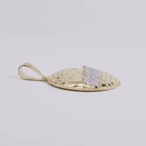 Gold textured pendant with decorative pattern.